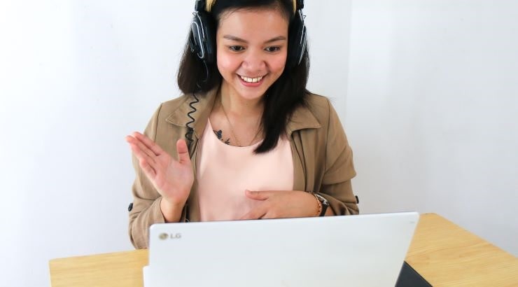 female student video call on laptop