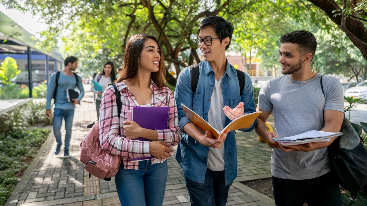 students walking and talking on campus